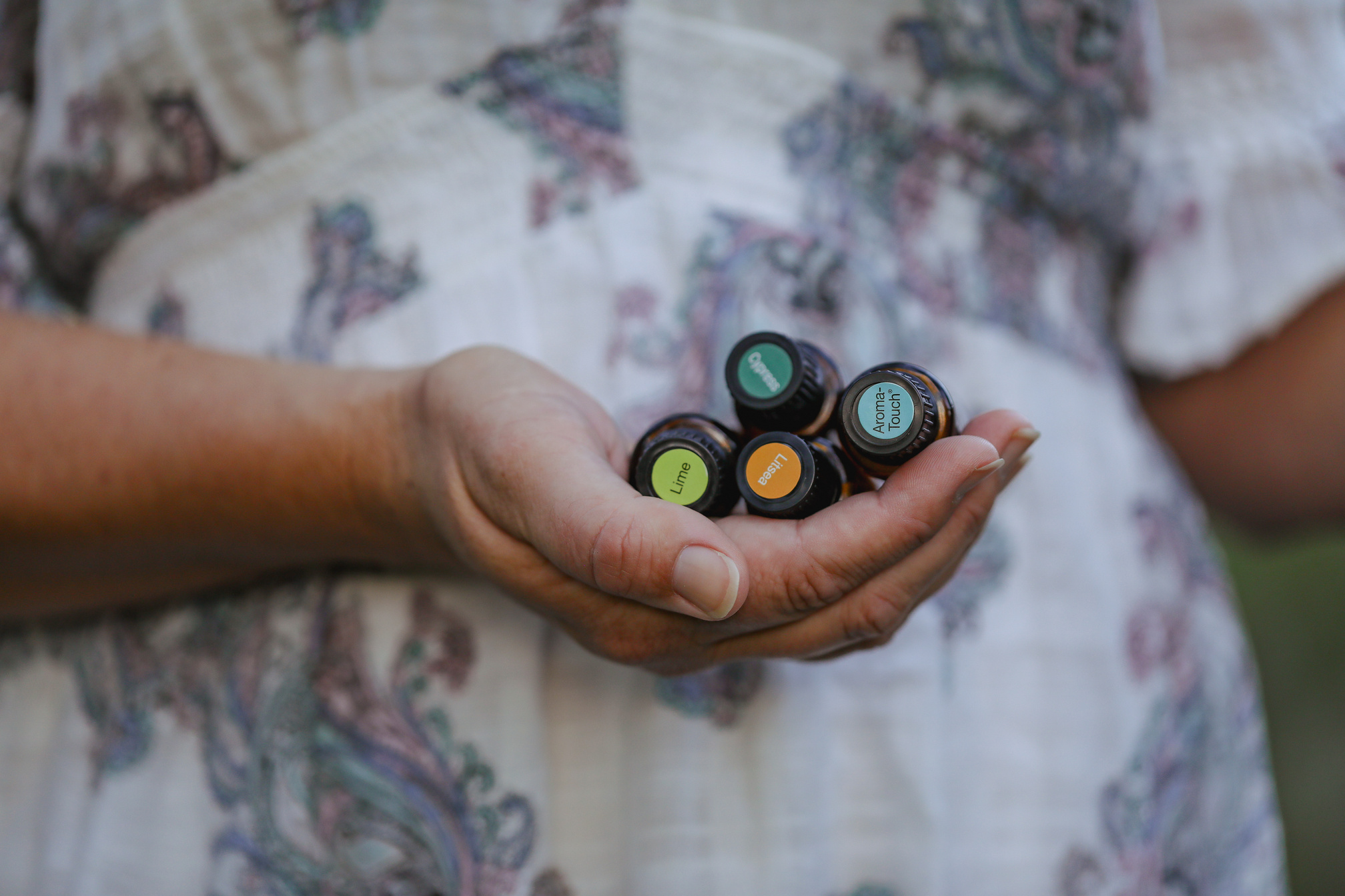 Firefly NSW Australia - 20 April 2022: Woman in Forest Holding Bundle of Doterra Essential Oils